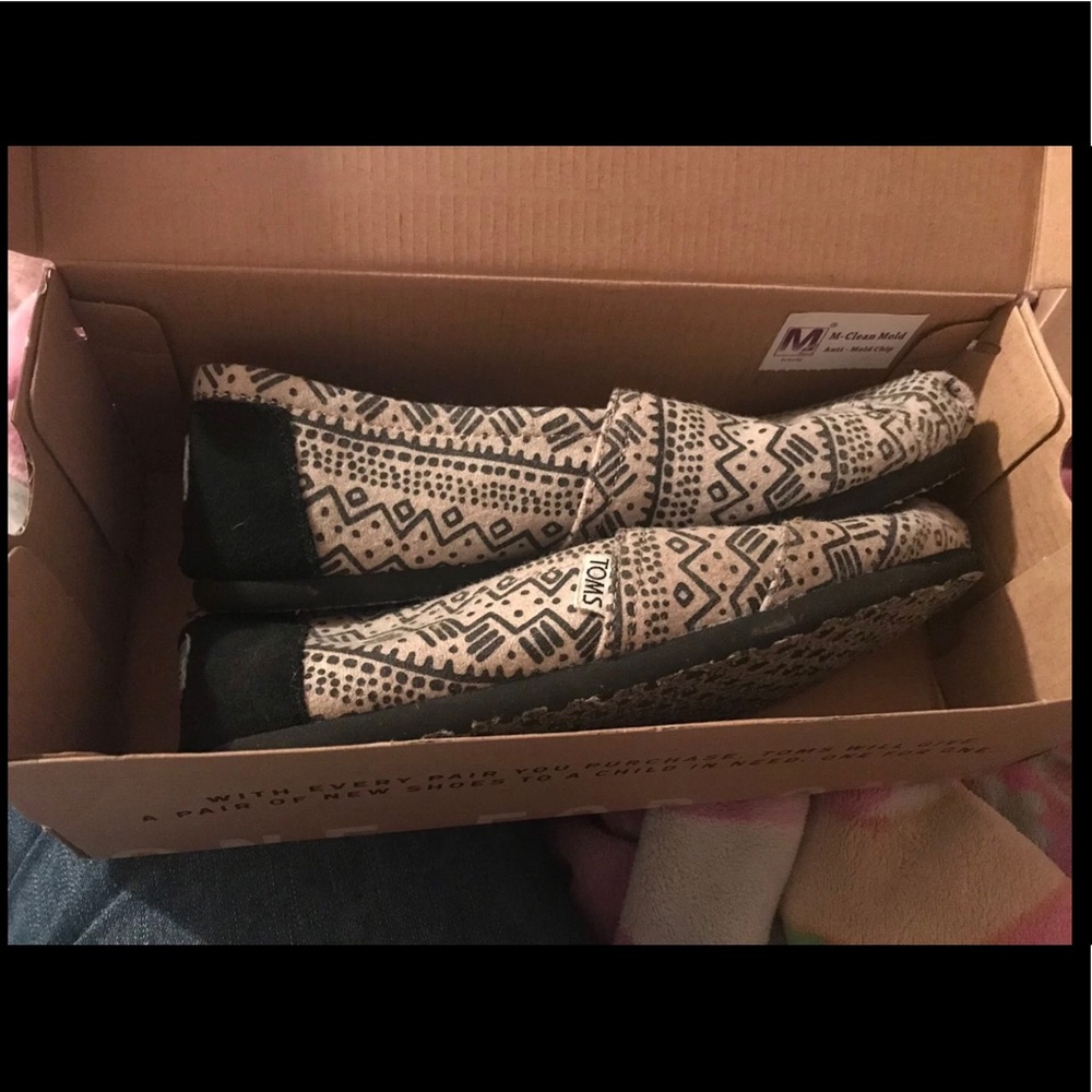 Tan and black patterned Toms